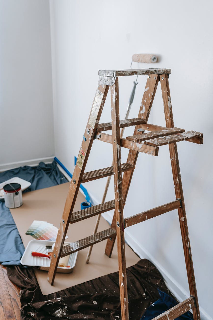 brown wooden stepladder inside a room