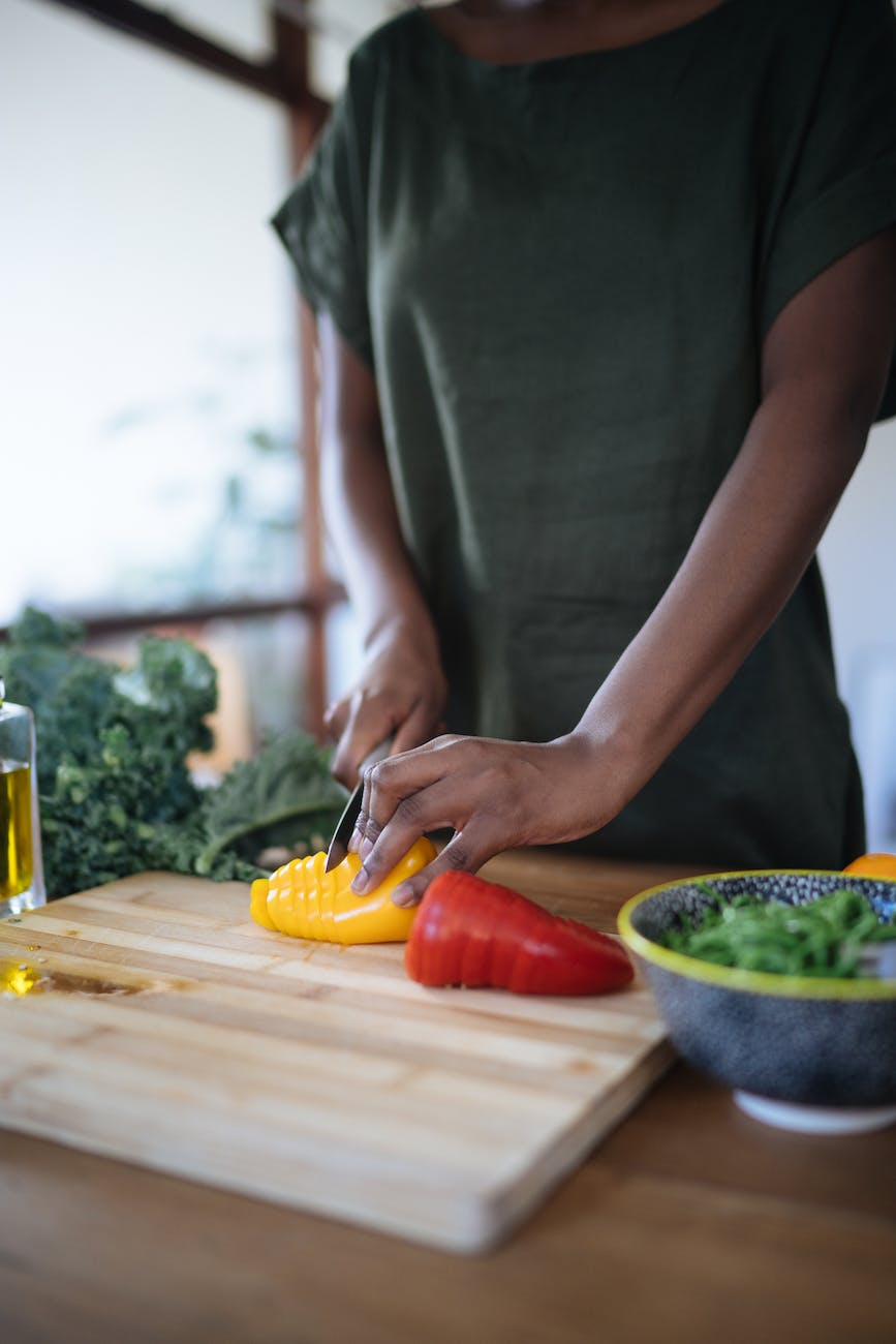 photo of person cutting bell peppers